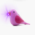 Pink cat shaped pen light with a purple LED facing left at an angle with purple lens flare