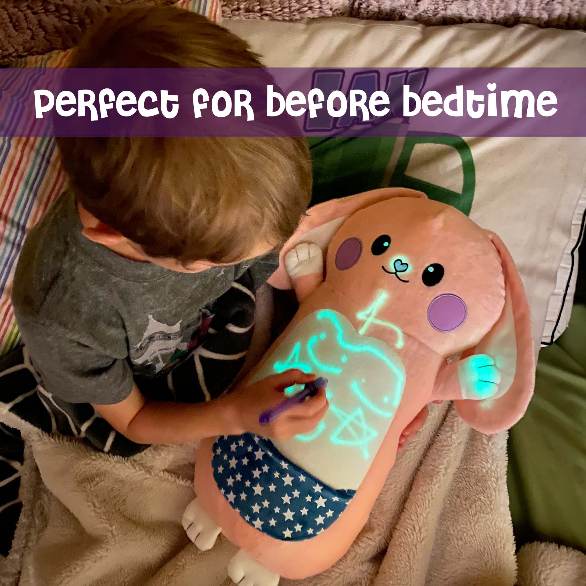 Boy hugging Bella the Bunny GlowMate by Bolderglow