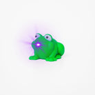 Green frog shaped pen light with a purple LED facing left an an angle with purple lens flare