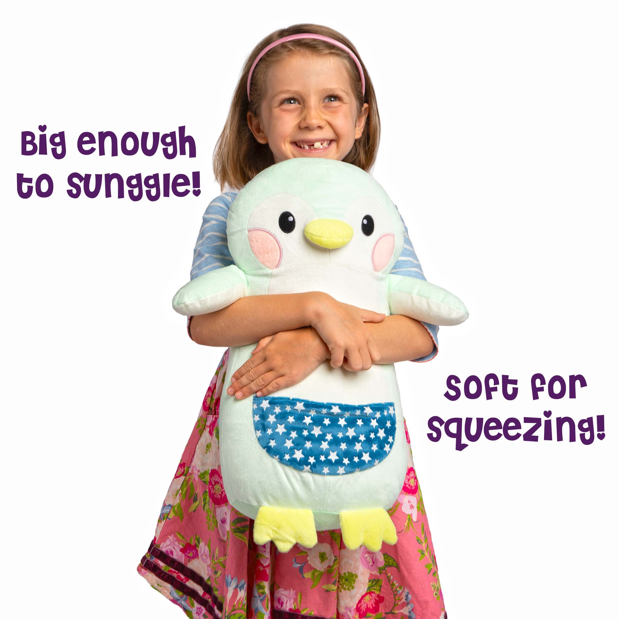 Girl hugging Penny the Penguin Glowmate by Bolderglow.
