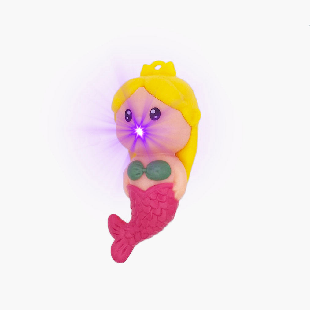 Mermaid shaped pen light with a purple LED facing left and showing LED flare