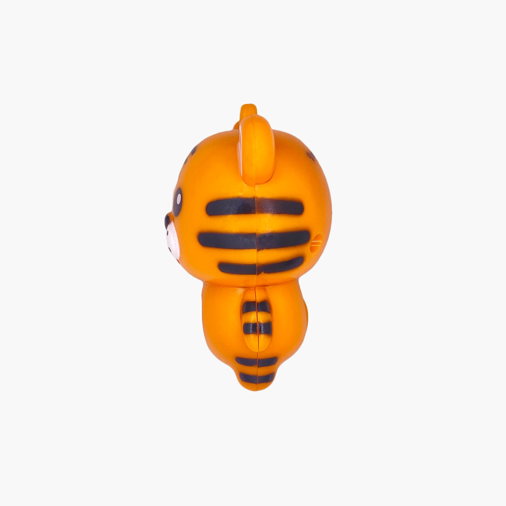 Orange tiger shaped pen light with a purple LED facing left