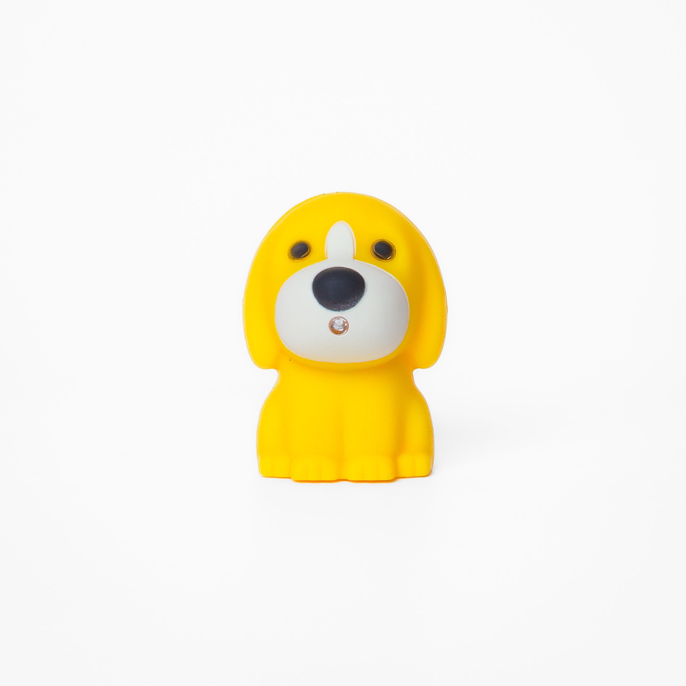 Yellow dog shaped pen light with a purple LED facing forward