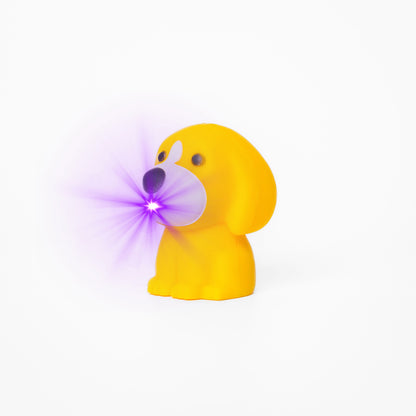 Yellow dog shaped pen light with a purple LED facing left at an angle with purple lens flare