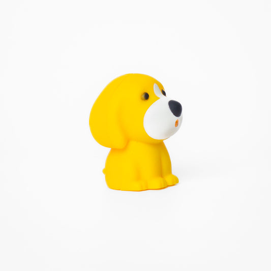Yellow dog shaped pen light with a purple LED facing right at an angle