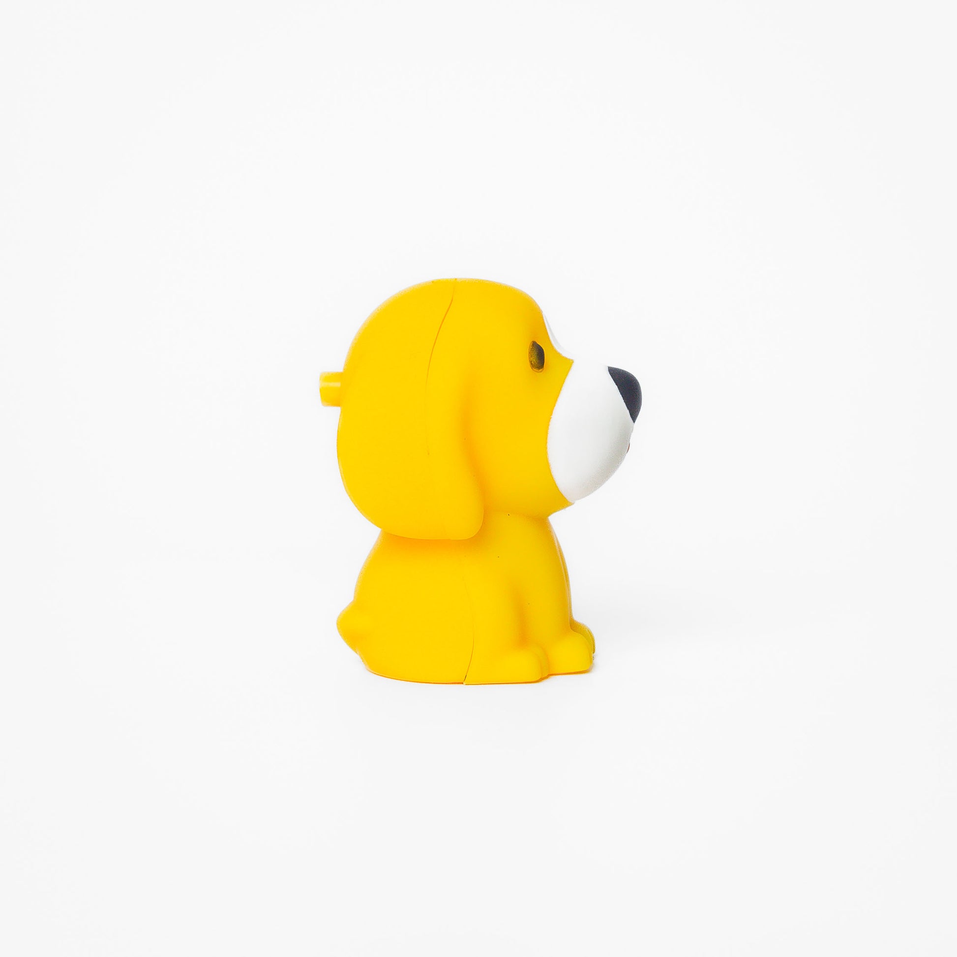 Yellow dog shaped pen light with a purple LED facing right