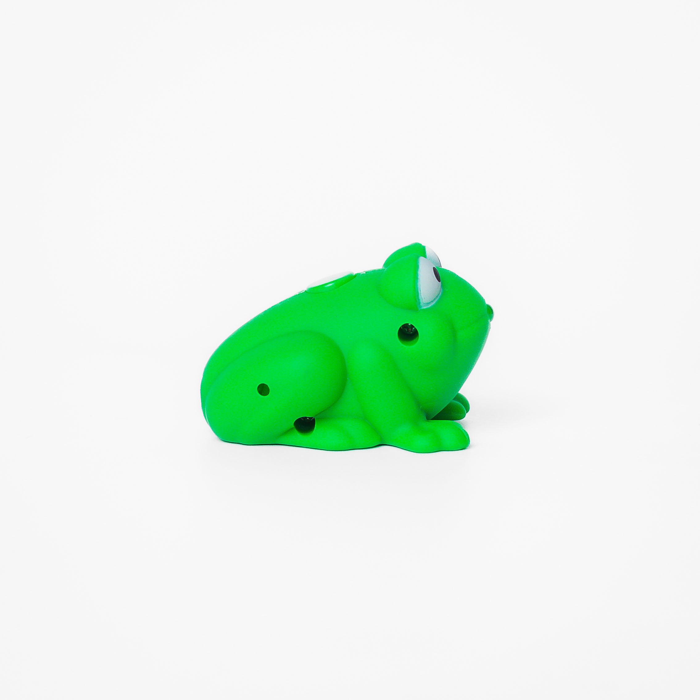Green frog shaped pen light with a purple LED facing right