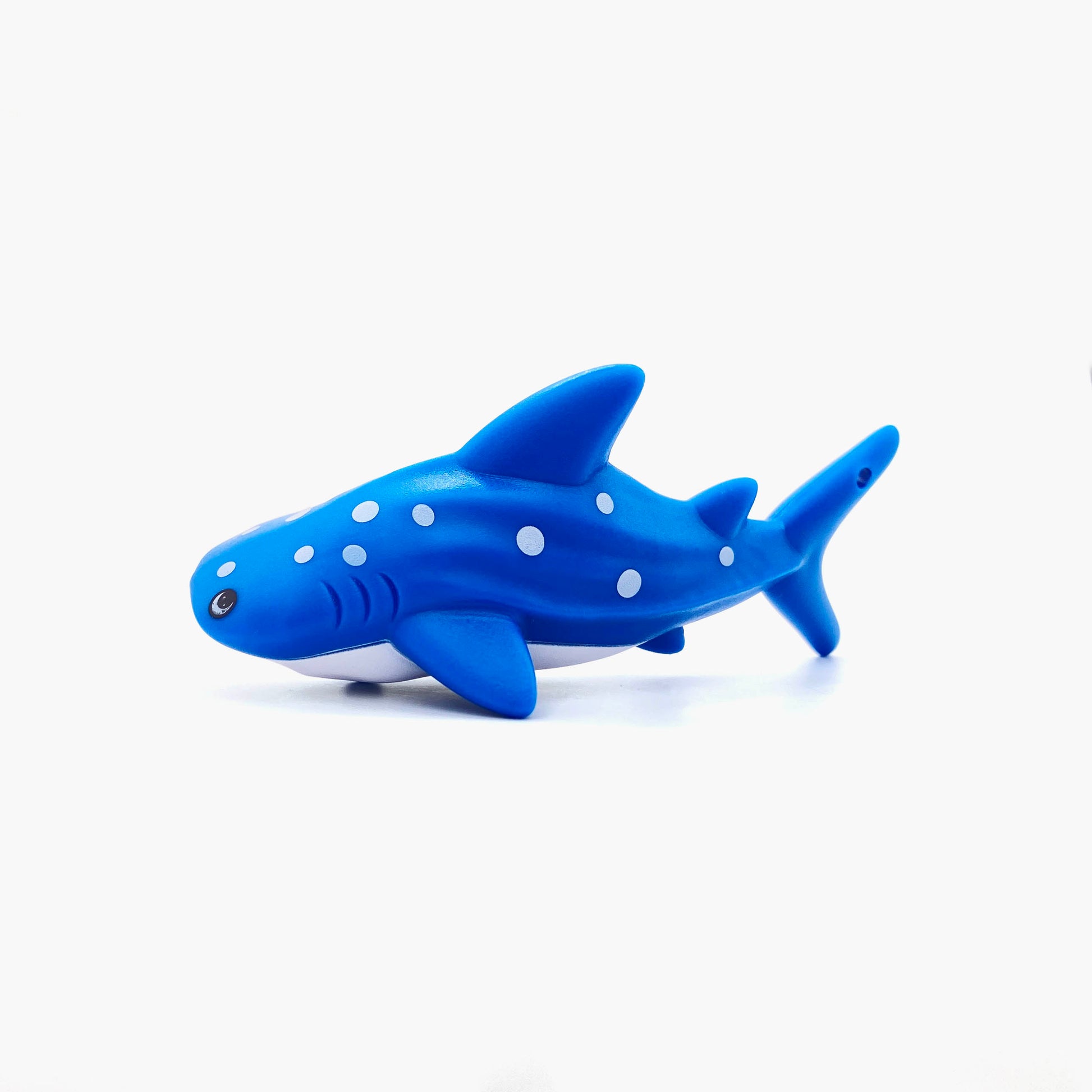 Blue whale shark shaped pen light with a purple LED facing left