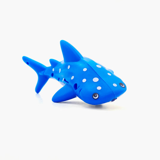 Blue whale shark shaped pen light with a purple LED facing right at an angle